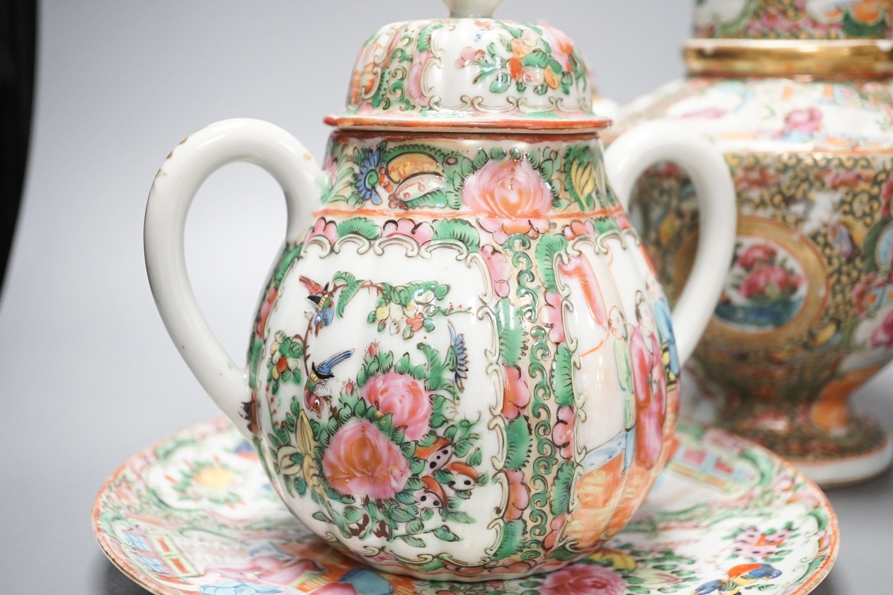 A 19th century Chinese famille rose teapot, sugar bowl, saucer dish vase and a similar yellow ground ‘dragon’ vase and cover 21cm